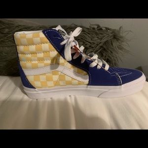 Blue and yellow high top vans